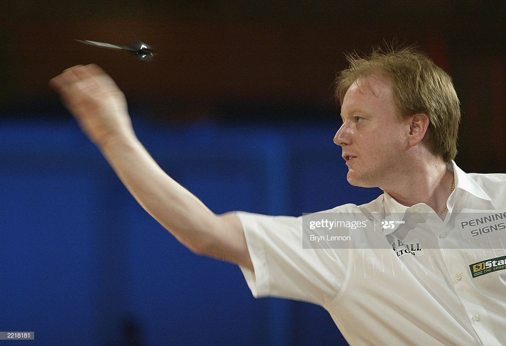BLACKPOOL, ENGLAND - JULY 28: Paul Williams throws during his first round match against Wayne Mardle in the PDC World Matchplay Darts Championship 2003 at Winter Gardens, on July 28, 2003 in Blackpool, England. (Photo by Bryn Lennon/Getty Images)